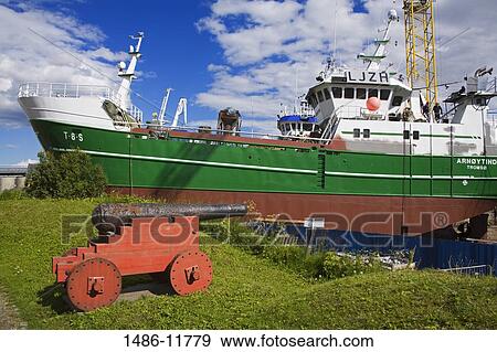 Stock Photo - Commercial fishing boat at a dry dock, Skansen, Tromso, Toms County, Nord-Norge, Norway. Fotosearch
