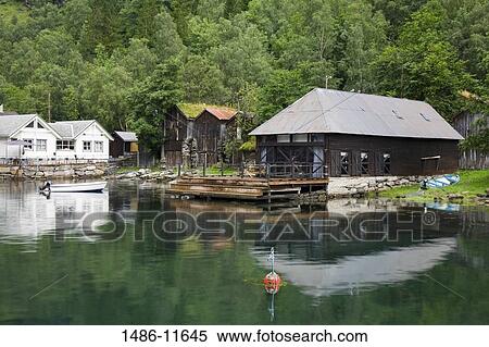 Stock Photography - Cottage at the waterfront, Geiranger, Geirangerfjord, More og Romsdal, Sunnmore, Norway. Fotosearch