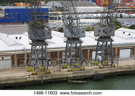 Cranes at a commercial dock, Southampton, Hampshire, England View Large Photo Image Stock Image - Cranes at a commercial dock, Southampton, Hampshire, England. Fotosearch
