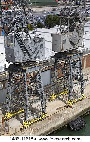 Stock Image - Cranes at a commercial dock, Southampton, Hampshire, England. Fotosearch