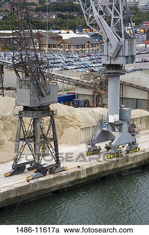 Stock Image - Cranes at a commercial dock, Southampton, Hampshire, England. Fotosearch