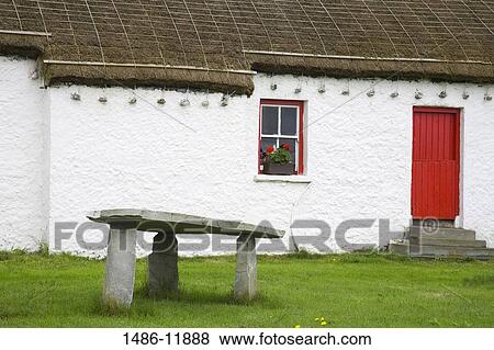 Dolmen in front of a folk museum, Folk Village Museum, Glencolmcille, County Donegal, Ulster Province, Ireland View Large Photo Image Stock Photo - Dolmen in front of a folk museum, Folk Village Museum, Glencolmcille, County Donegal, Ulster Province, Ireland. Fotosearch