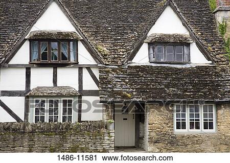 Facade of a Tudor style house, Lacock, Wiltshire, England View Large Photo Image Stock Image - Facade of a Tudor style house, Lacock, Wiltshire, England. Fotosearch