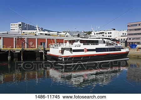 Stock Photography - Ferry moored at the dock, Tromso, Toms County, Nord-Norge, Norway. Fotosearch