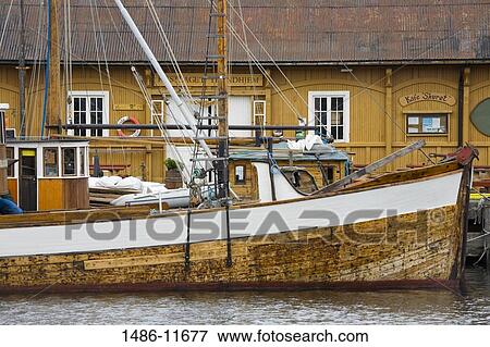 Fishing boat moored at a harbor, Ravnkloa, Trondheim, Trondelag County, Trondelag, Norway View Large Photo Image Stock Photo - Fishing boat moored at a harbor, Ravnkloa, Trondheim, Trondelag County, Trondelag, Norway. Fotosearch