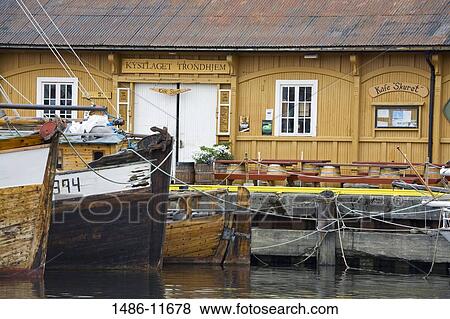 Stock Photo - Fishing boats moored at a harbor, Ravnkloa, Trondheim, Trondelag County, Trondelag, Norway. Fotosearch
