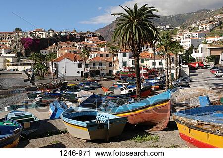 Fishing boats on the beach in front of a small town, Camara de Lobos, Madeira, Portugal View Large Photo Image Stock Image - Fishing boats on the beach in front of a small town, Camara de Lobos, Madeira, Portugal. Fotosearch