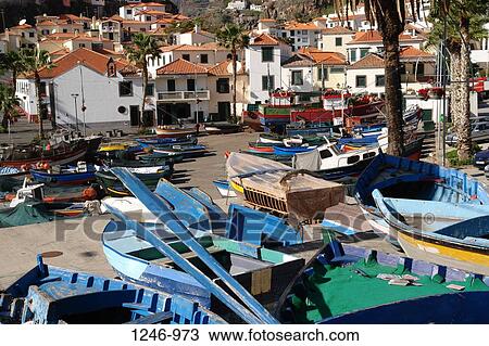 Fishing boats on the beach in front of a small town, Camara de Lobos, Madeira, Portugal View Large Photo Image Stock Image - Fishing boats on the beach in front of a small town, Camara de Lobos, Madeira, Portugal. Fotosearch