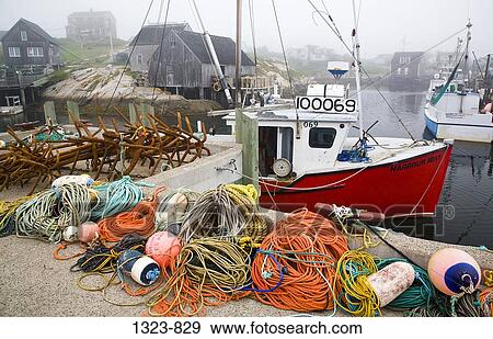 Stock Photo - Fishing bobbers and ropes on a pier, Peggy's Cove, Nova Scotia, Canada. Fotosearch