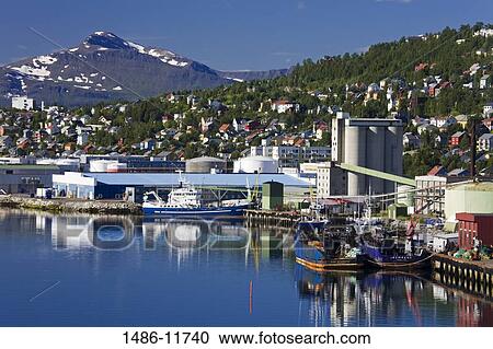 Stock Image - Fishing trawler at a commercial dock, Tromso, Toms County, Nord-Norge, Norway. Fotosearch