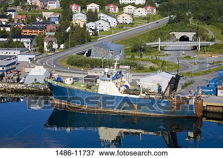 Stock Photo - Fishing trawler at a commercial dock, Tromso, Toms County, Nord-Norge, Norway. Fotosearch