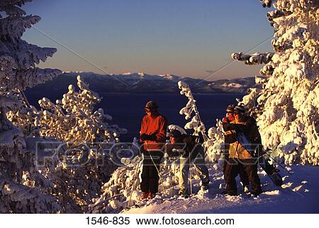 Four people skiing at sunrise, Diamond Peak, Nevada, USA View Large Photo Image Stock Photography - Four people skiing at sunrise, Diamond Peak, Nevada, USA. Fotosearch