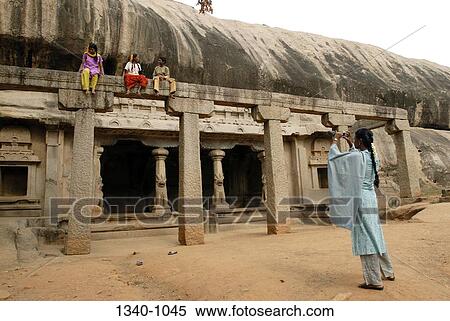 Girl taking a picture of her friends at a temple, Ramanuja Mandapa, Mahabalipuram, Tamil Nadu, India View Large Photo Image Stock Photography - Girl taking a picture of her friends at a temple, Ramanuja Mandapa, Mahabalipuram, Tamil Nadu, India. Fotosearch