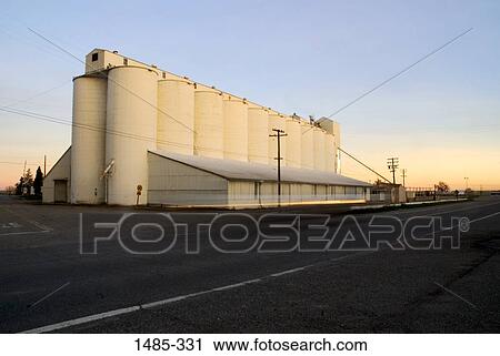Grain elevators at the roadside, Sacramento Valley, Central Valley, California, USA View Large Photo Image Stock Image - Grain elevators at the roadside, Sacramento Valley, Central Valley, California, USA. Fotosearch