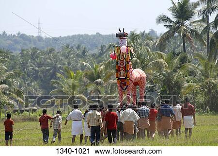 Group of people carrying poykuthiras in Machattu vela festival, Machattu Thiruvanikavu Temple, Wadakanchery, Thrissur District, Kerala, India View Large Photo Image Stock Image - Group of people carrying poykuthiras in Machattu vela festival, Machattu Thiruvanikavu Temple, Wadakanchery, Thrissur District, Kerala, India. Fotosearch