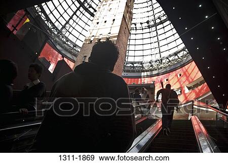 Group of people on an escalator in a shopping mall, Melbourne Central Mall, Melbourne, Victoria, Australia View Large Photo Image Stock Photo - Group of people on an escalator in a shopping mall, Melbourne Central Mall, Melbourne, Victoria, Australia. Fotosearch