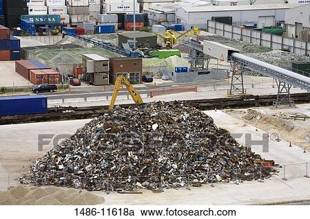 Stock Image - Heap of metal scrap at the commercial dock, Southampton, Hampshire, England. Fotosearch