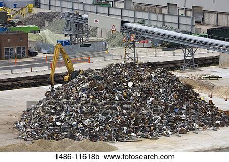 Stock Image - Heap of metal scrap at the commercial dock, Southampton, Hampshire, England. Fotosearch