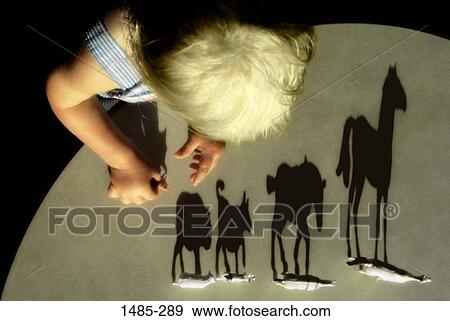 High angle view of a boy playing with toys View Large Photo Image Stock Photo - High angle view of a boy playing with toys. Fotosearch