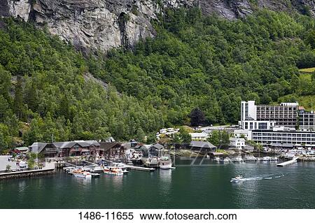 High angle view of a town at the waterfront, Geiranger, Geirangerfjord, More og Romsdal, Sunnmore, Norway View Large Photo Image Stock Photography - High angle view of a town at the waterfront, Geiranger, Geirangerfjord, More og Romsdal, Sunnmore, Norway. Fotosearch