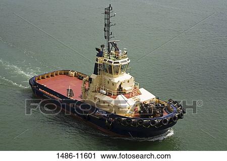 Stock Image - High angle view of a tugboat in the sea, Southampton, Hampshire, England. Fotosearch