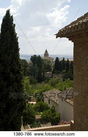 Stock Photograph - High angle view of buildings Surrounded by trees, Alhambra, Granada, Andalusia, Spain. Fotosearch