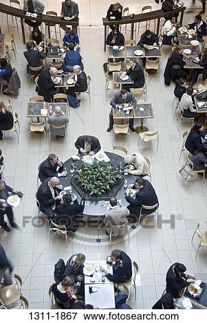 High angle view of business executives having lunch in food court, Melbourne, Victoria, Australia View Large Photo Image Stock Photo - High angle view of business executives having lunch in food court, Melbourne, Victoria, Australia. Fotosearch