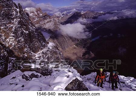 High angle view of two men climbing a mountain, Mt Edith Cavell, Banff National Park, Alberta, Canada View Large Photo Image Stock Image - High angle view of two men climbing a mountain, Mt Edith Cavell, Banff National Park, Alberta, Canada. Fotosearch