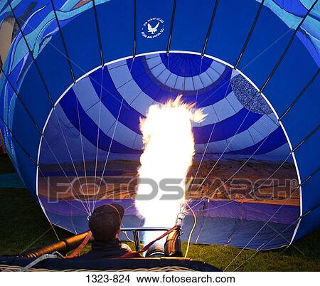 Hot air balloon being inflated with a propane heater, Bend, Oregon, USA View Large Photo Image Picture - Hot air balloon being inflated with a propane heater, Bend, Oregon, USA. Fotosearch