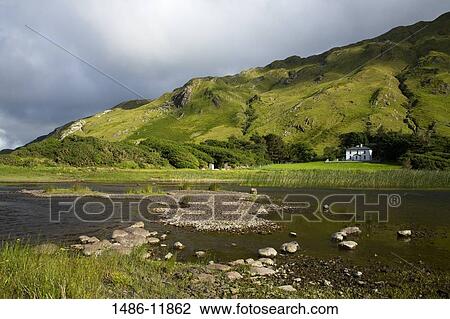Lake with a hotel and a hill in the background, Lake Kylemore, Connemara, County Galway, Connacht Province, Republic of Ireland View Large Photo Image Stock Image - Lake with a hotel and a hill in the background, Lake Kylemore, Connemara, County Galway, Connacht Province, Republic of Ireland. Fotosearch