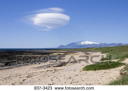 Lenticular cloud over the sea, Iceland View Large Photo Image Stock Image - Lenticular cloud over the sea, Iceland. Fotosearch
