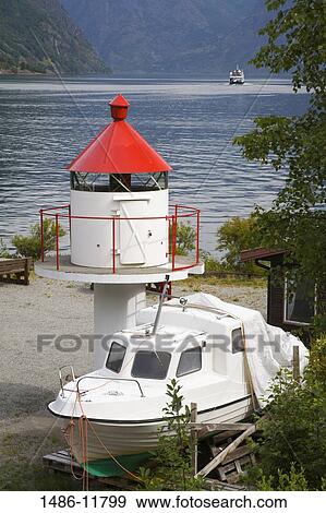 Lighthouse and a motorboat on the coast, Flam, Aurlandsfjord, Sogn Og Fjordane, Norway View Large Photo Image Stock Photo - Lighthouse and a motorboat on the coast, Flam, Aurlandsfjord, Sogn Og Fjordane, Norway. Fotosearch