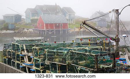 Lobster traps on a pier, Peggy's Cove, Nova Scotia, Canada View Large Photo Image Stock Image - Lobster traps on a pier, Peggy's Cove, Nova Scotia, Canada. Fotosearch