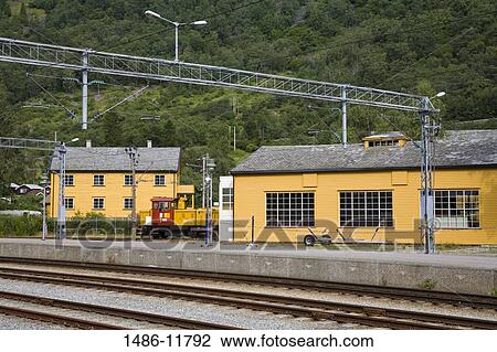 Stock Image - Locomotive at a railway station, Flam Station, Flam, Aurlandsfjord, Sogn Og Fjordane, Norway. Fotosearch