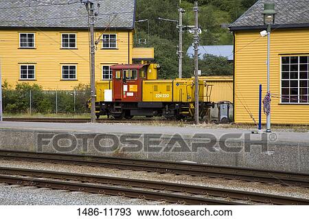 Stock Image - Locomotive at a railway station, Flam Station, Flam, Aurlandsfjord, Sogn Og Fjordane, Norway. Fotosearch