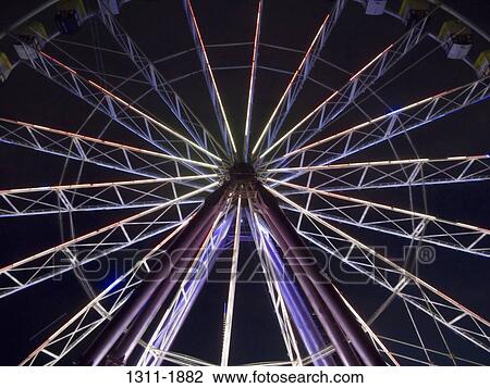 Low angle view of a ferris wheel lit up at night, Melbourne Park, Melbourne, Victoria, Australia View Large Photo Image Stock Image - Low angle view of a ferris wheel lit up at night, Melbourne Park, Melbourne, Victoria, Australia. Fotosearch
