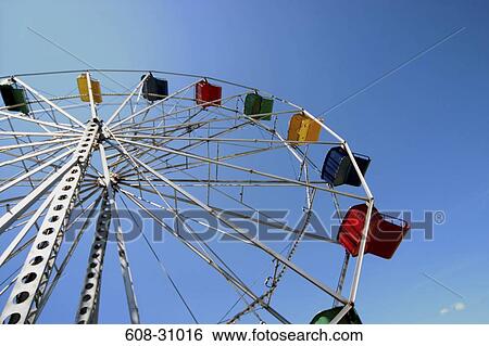 Low angle view of a ferris wheel View Large Photo Image Stock Photograph - Low angle view of a ferris wheel. Fotosearch
