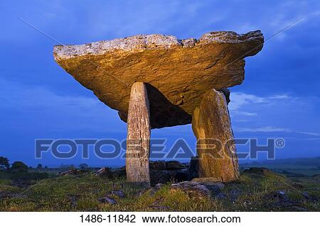 Low angle view of a megalithic stone tomb, Poulnabrone Dolmen, The Burren, County Clare, Munster Province, Republic of Ireland View Large Photo Image Stock Image - Low angle view of a megalithic stone tomb, Poulnabrone Dolmen, The Burren, County Clare, Munster Province, Republic of Ireland. Fotosearch