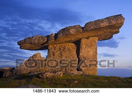 Low angle view of a megalithic stone tomb, Poulnabrone Dolmen, The Burren, County Clare, Munster Province, Republic of Ireland View Large Photo Image Stock Image - Low angle view of a megalithic stone tomb, Poulnabrone Dolmen, The Burren, County Clare, Munster Province, Republic of Ireland. Fotosearch