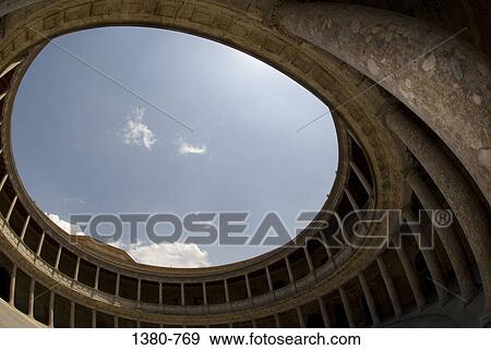 Low angle view of a palace, Palace Of Charles V, Alhambra, Granada, Andalusia, Spain View Large Photo Image Stock Photo - Low angle view of a palace, Palace Of Charles V, Alhambra, Granada, Andalusia, Spain. Fotosearch