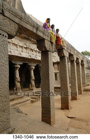 Stock Photograph - Low angle view of girls and a boy at a temple, Ramanuja Mandapa, Mahabalipuram, Tamil Nadu, India. Fotosearch