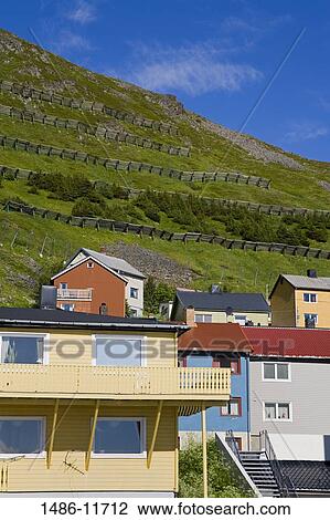 Low angle view of houses with terraced fields in the background, Honningsvag Port, Honningsvag, Mageroya Island, Nordkapp, Finnmark County, Norway View Large Photo Image Stock Image - Low angle view of houses with terraced fields in the background, Honningsvag Port, Honningsvag, Mageroya Island, Nordkapp, Finnmark County, Norway. Fotosearch