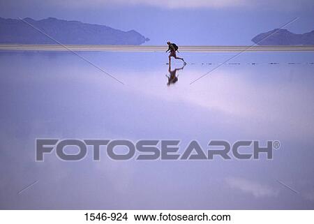 Man crossing salt flats, Bonneville Salt Flats, Utah, USA View Large Photo Image Picture - Man crossing salt flats, Bonneville Salt Flats, Utah, USA. Fotosearch