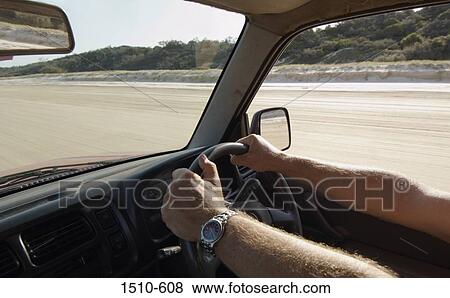 Man driving a car View Large Photo Image Stock Photo - Man driving a car. Fotosearch