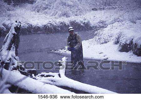 Man fly-fishing in a river, Truckee, Nevada County, California, USA View Large Photo Image Stock Photograph - Man fly-fishing in a river, Truckee, Nevada County, California, USA. Fotosearch
