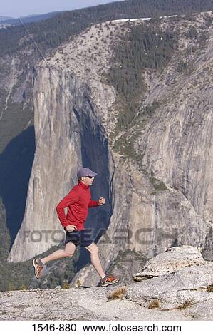 Man running on rocks, El Capitan, Yosemite National Park, California, USA View Large Photo Image Stock Image - Man running on rocks, El Capitan, Yosemite National Park, California, USA. Fotosearch