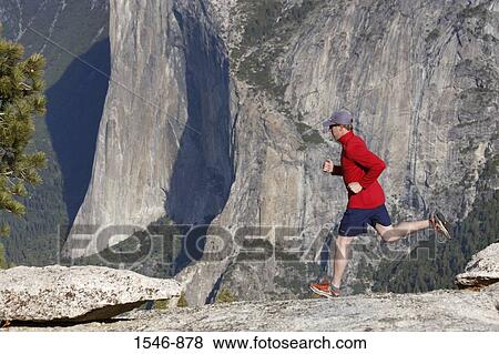 Man running on rocks, El Capitan, Yosemite National Park, California, USA View Large Photo Image Stock Photo - Man running on rocks, El Capitan, Yosemite National Park, California, USA. Fotosearch