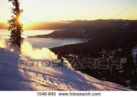 Man skiing at sunset, Diamond Peak, Nevada, USA View Large Photo Image Stock Photography - Man skiing at sunset, Diamond Peak, Nevada, USA. Fotosearch