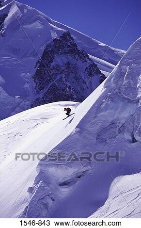 Man skiing on powder snow, Chamonix, Rhone-Alpes, France View Large Photo Image Stock Image - Man skiing on powder snow, Chamonix, Rhone-Alpes, France. Fotosearch