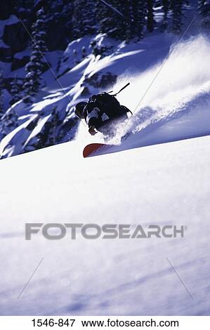 Man snowboarding in powder snow, Brighton, Utah, USA View Large Photo Image Stock Photo - Man snowboarding in powder snow, Brighton, Utah, USA. Fotosearch